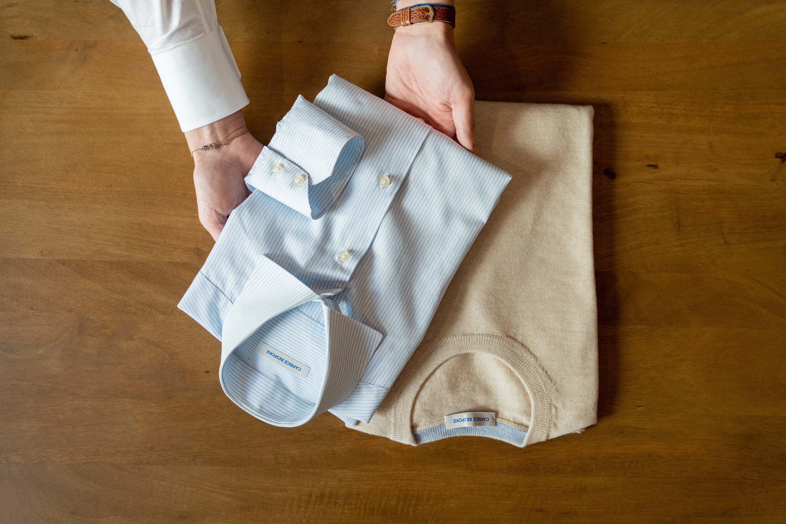 white-and-light-blue-striped-dress-shirt-and-sand-knitwear