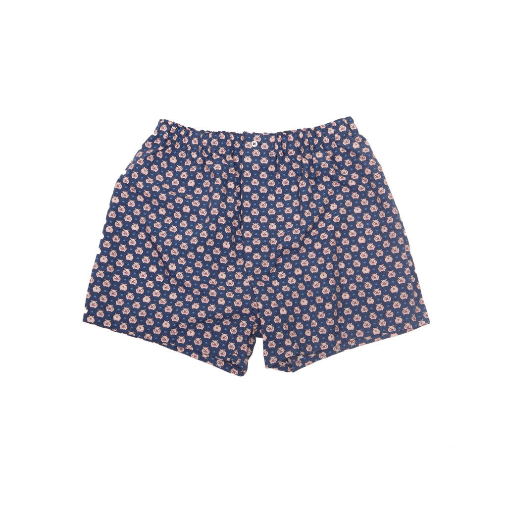 Boxer avec sac de frappe et petits cochons