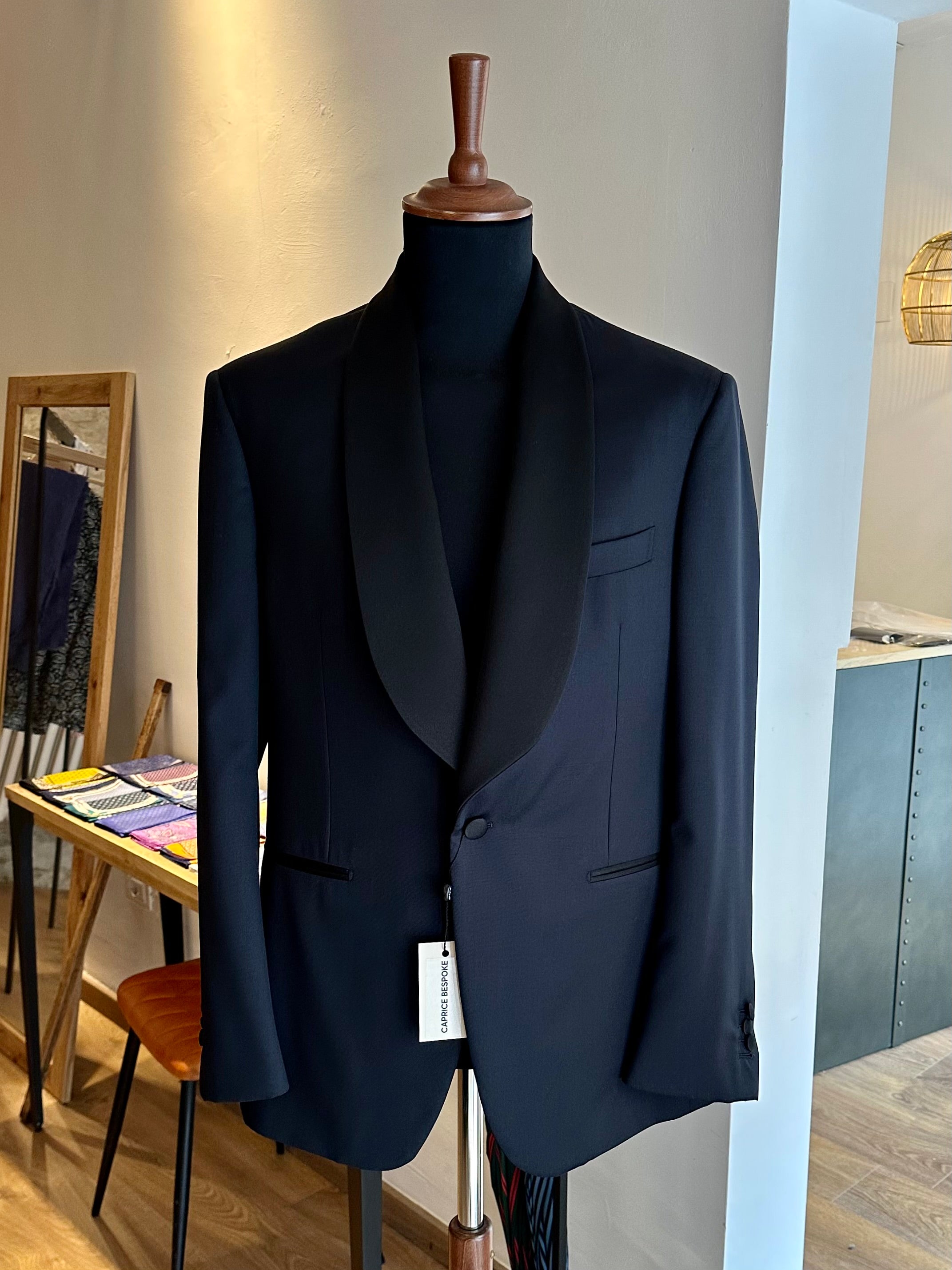 black-tailored-tuxedo-with-shawl-lapel-on-mannequin-by-caprice-bespoke