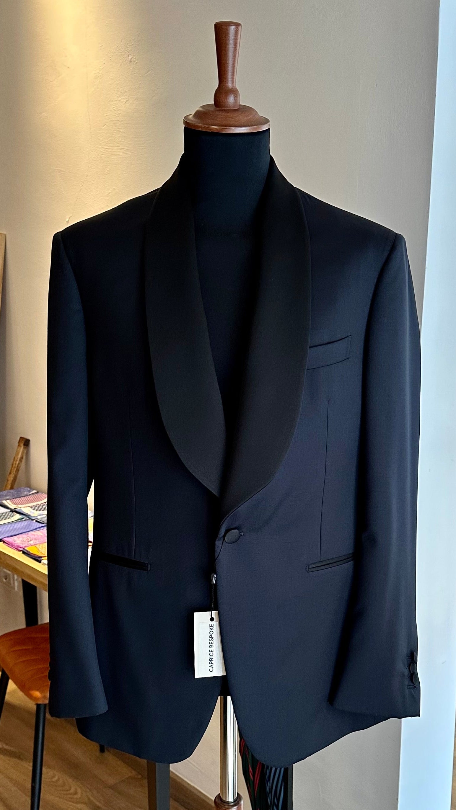 black-bespoke-tuxedo-jacket-with-satin-shawl-lapel-on-mannequin
