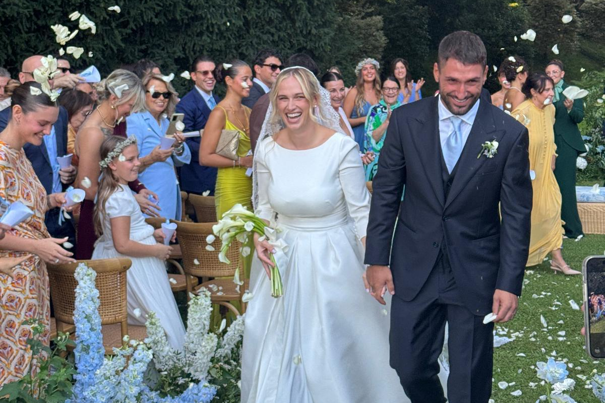 groom-in-a-tailored-attire-walking-down–the-aisle-with-brid