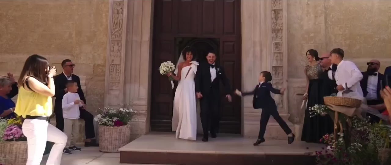 bespoke-wedding-services-groom-black-tuxedo-bow-tie-elegant-ceremony-look